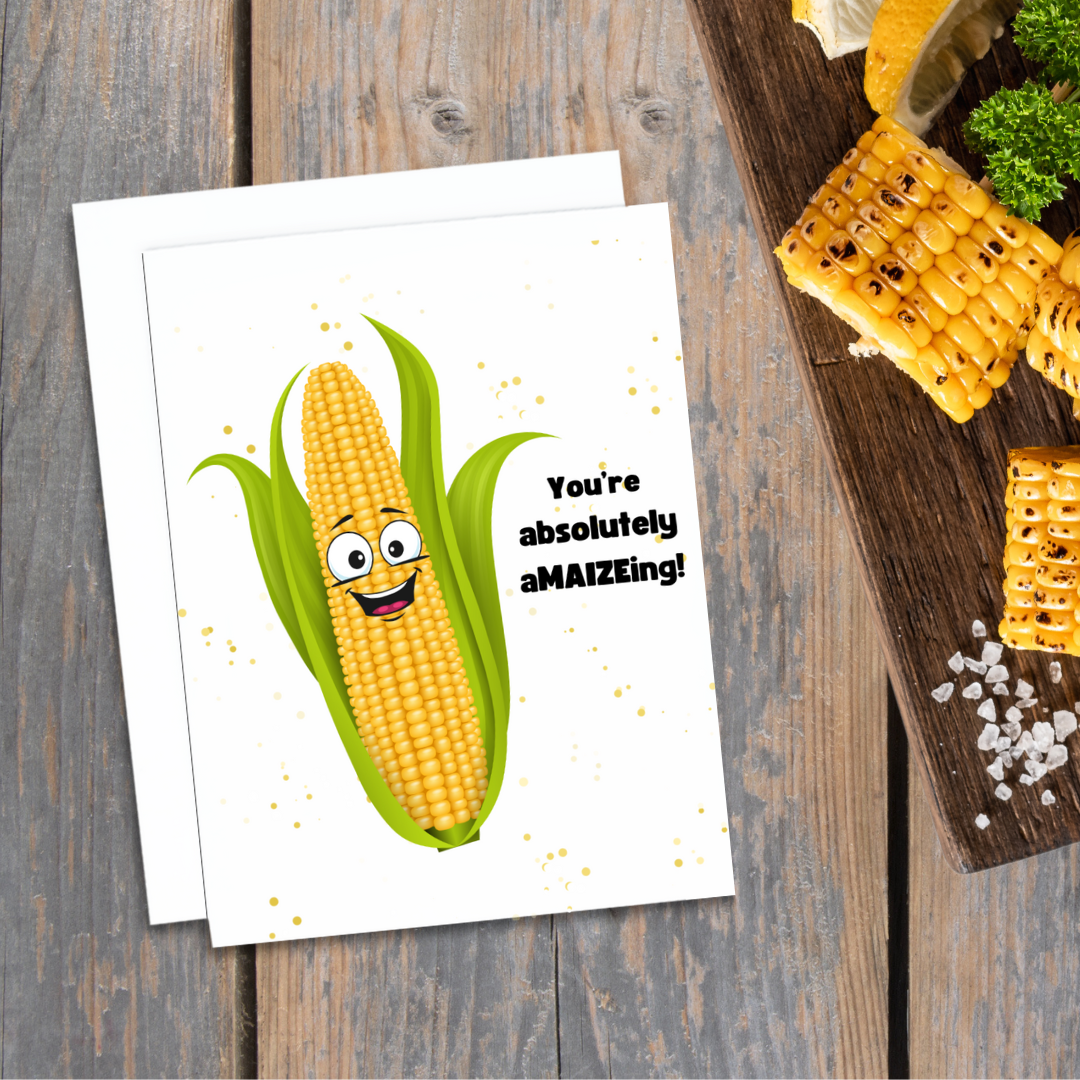 Funny greeting card. A graphic of a smiling corn cob. Text reads, You're Absolutely AMAIZEing!