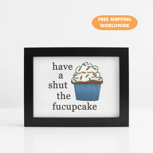 A photo of an art print. It has a blue cupcake on it. Text reads, Have a Shut the Fucupcake.