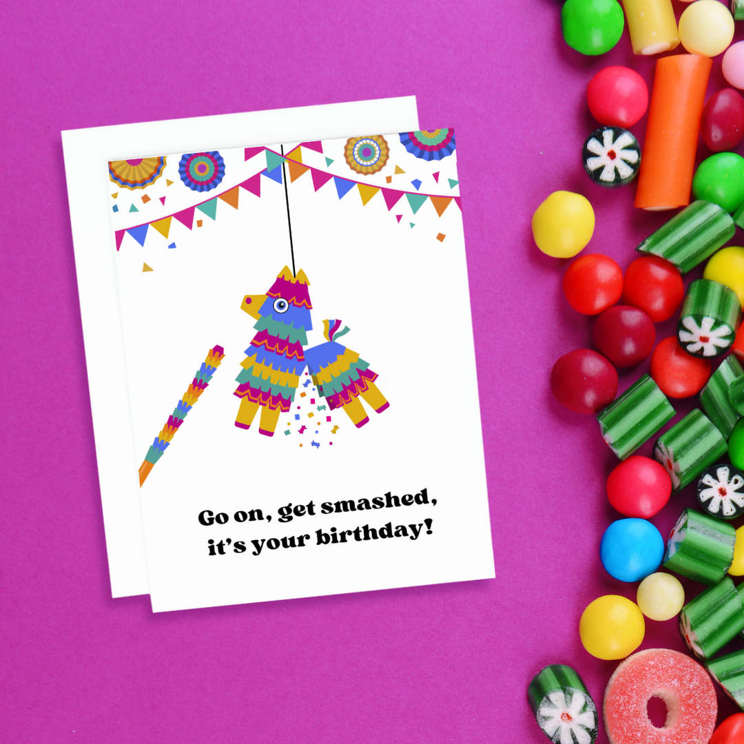 A photo of a birthday card. It has a piñata on it. Text reads, go on get smashed it's your birthday!