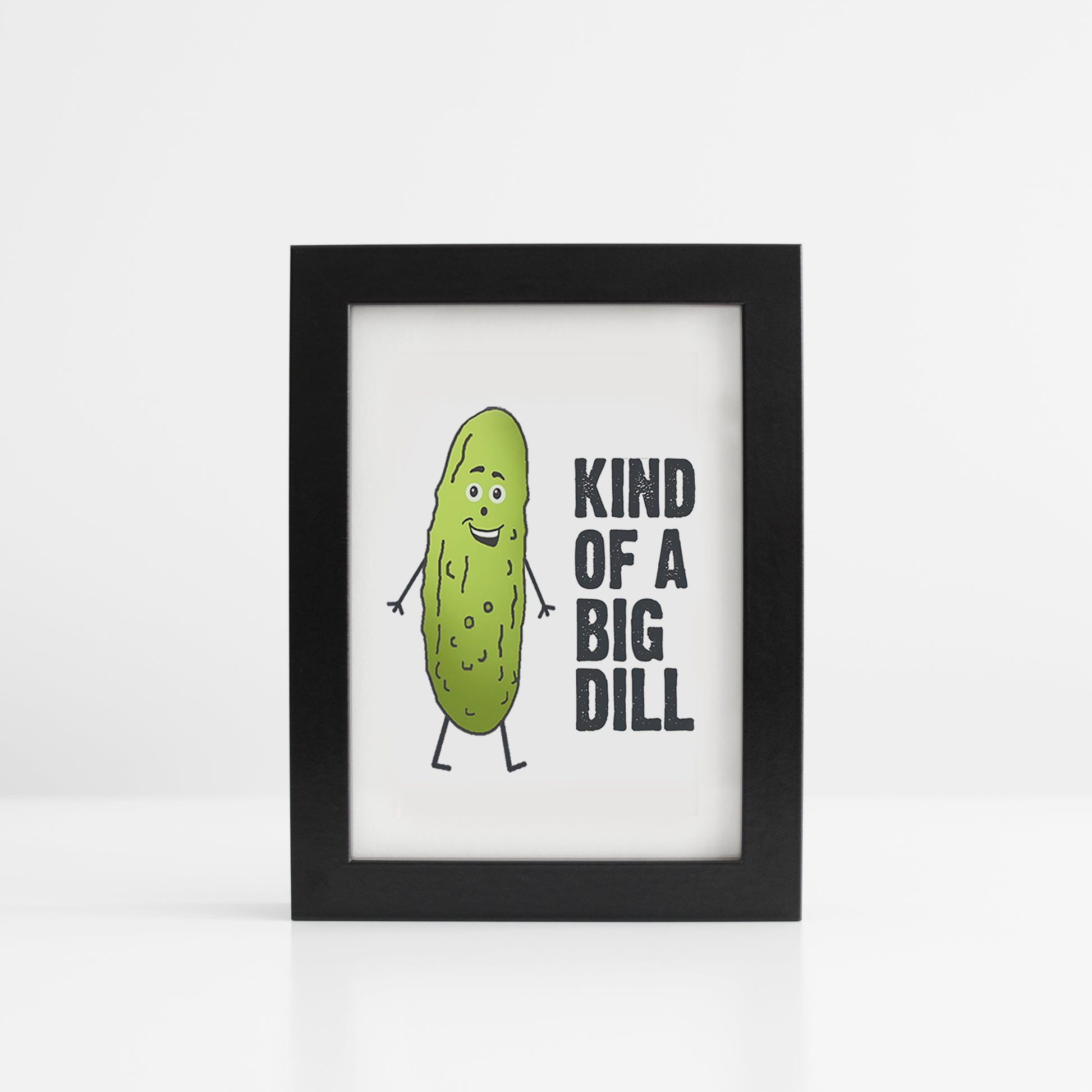 A photo of a smiling pickle. Text reads, Kind of a Big Dill.