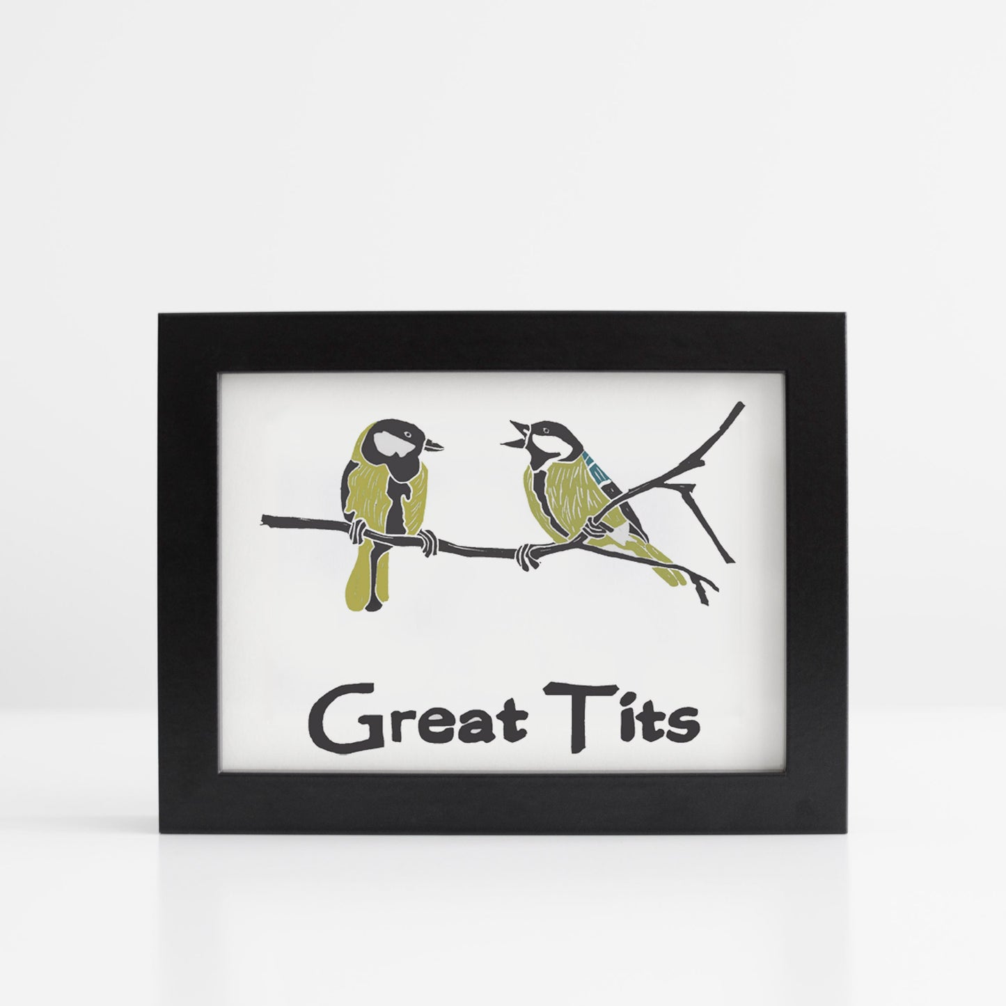 A photo of an art print. It has two blue tits on a branch. Text reads, Great Tits